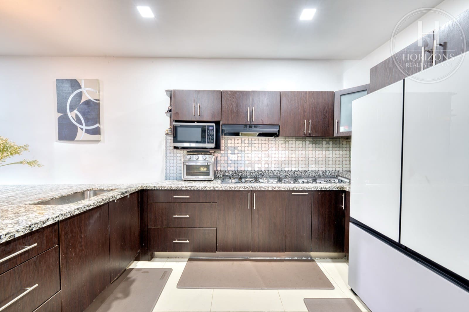 Casa en venta Condominio Cedros del Este Curridabat - cocina en U con granito